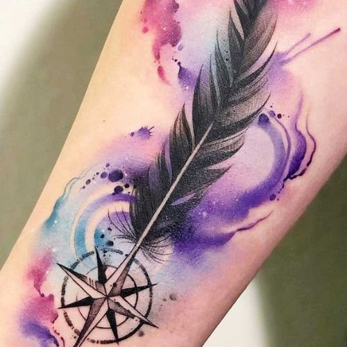 Beautiful watercolor feather tattoo with smoke and stars. Showing beautiful colors and gradient shading at dark shader tattoo parlour in Kolkata.