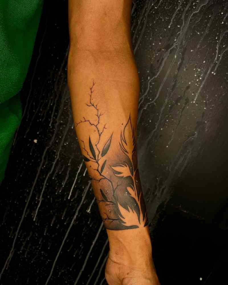 A detailed hand tattoo design featuring a leaf and lightning with dark shading, created by expert tattoo artists at Dark Shader Tattoo in Kolkata.