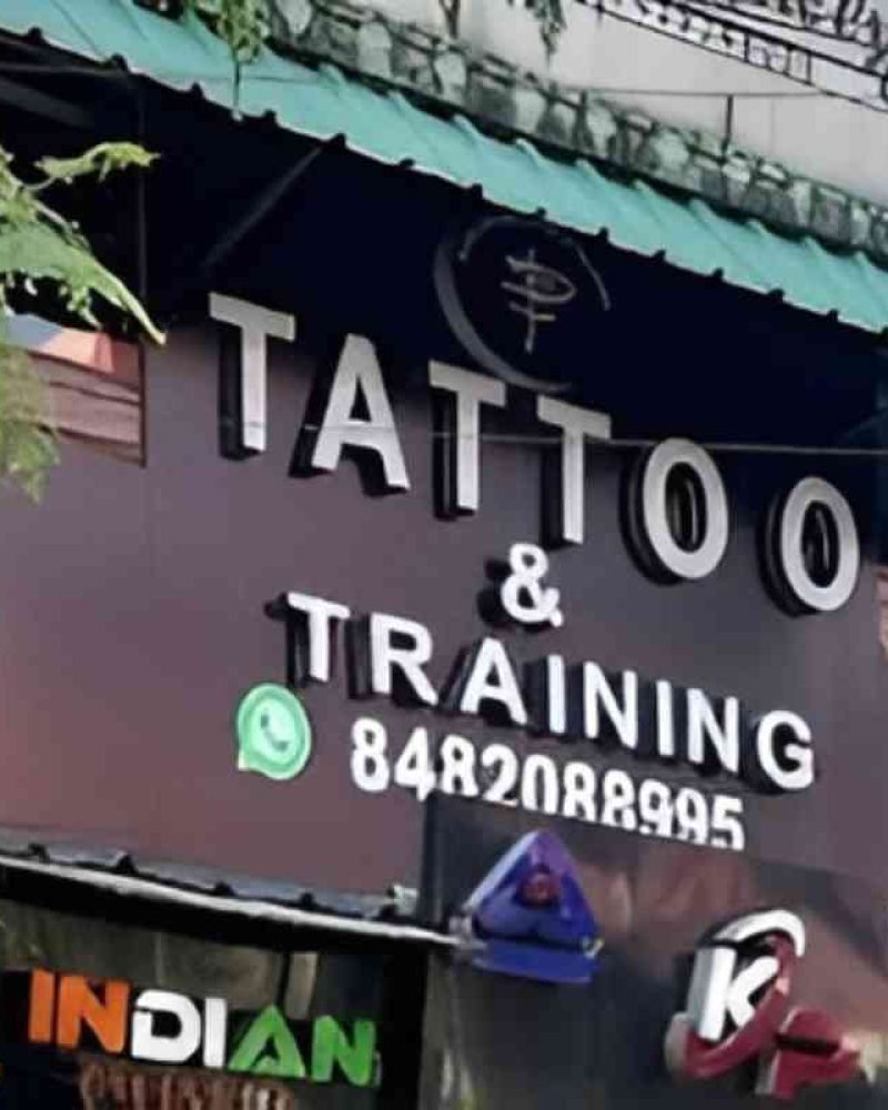 Dark shader tattoo & training board showing branding, logo and whatsapp number