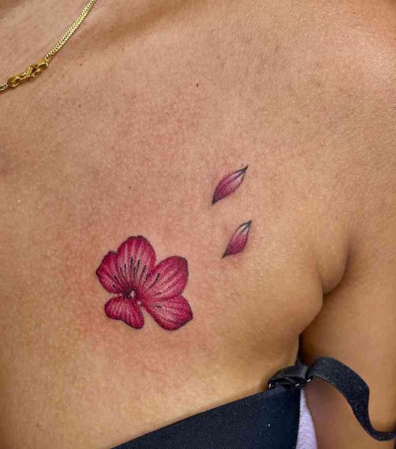 A pink flower and petals tattoo design on a girl’s chest at our tattoo parlour in Kolkata, low tattoo cost in kolkata..